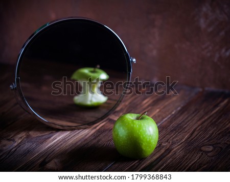 Apple reflecting in the mirror surrealistic picture abstract vision Royalty-Free Stock Photo #1799368843