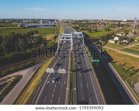 Highway near capital city, bypass of large city. Drone, aerial view.