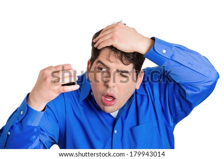 Closeup portrait of shocked funny looking guy, business man feeling head, surprised he is losing hair receding hairline, upset isolated on white background. Negative facial expression emotion feeling