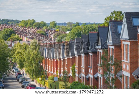 Row of English terraced houses on hilly area in Crouch End, North London Royalty-Free Stock Photo #1799471272