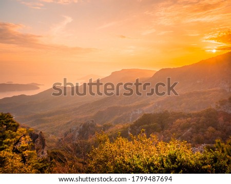 The Landscape of Mountains with Maple Leaves after Sunset in Autumn or Fall, Kankakei in Kagawa Prefecture Royalty-Free Stock Photo #1799487694