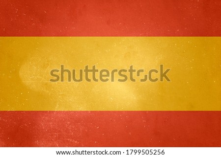 Spanish flag painted on old wall. 