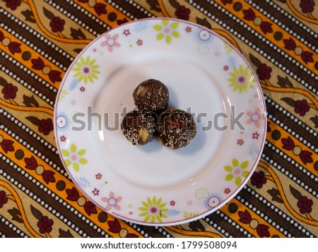 delicious indian laddu in zigzag background.
