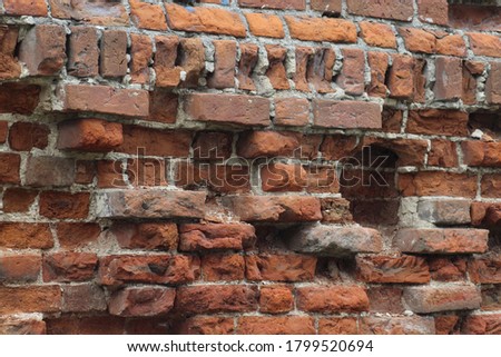 Textured brick wall. An ancient red brick wall. Beautiful natural background