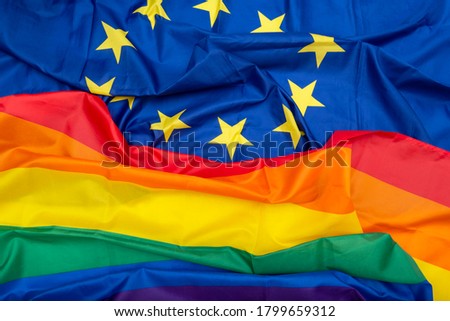Fabric European Union EU and Rainbow flags, concept picture about human rights