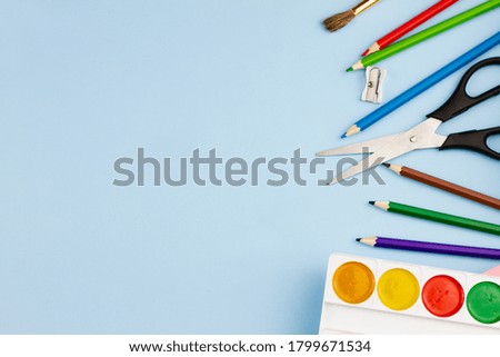 Various office supplies on a blue background. Photo banner. Place for your text. Education concept.