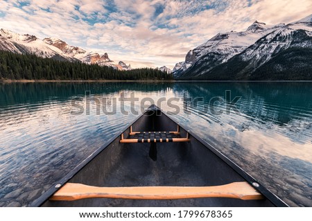Canoeing with Canadian Rockies in Spirit Island on Maligne Lake at Jasper national park, Canada Royalty-Free Stock Photo #1799678365