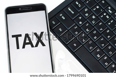 text TAX on the phone. Financial, business concept