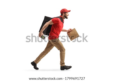 Full length profile shot of a delivery man running with a bag and a payment terminal and delivering food isolated on white background