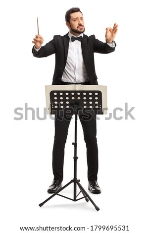 Young male conductor directing a performance isolated on white background Royalty-Free Stock Photo #1799695531