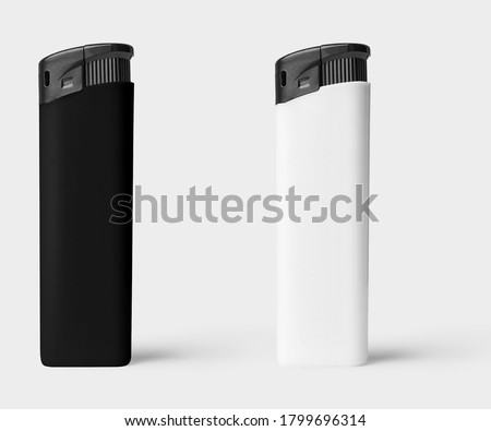 Black and white plastic lighter on white background Royalty-Free Stock Photo #1799696314