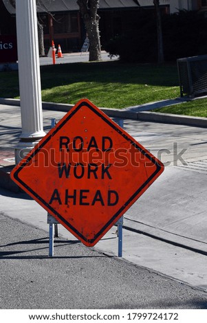 Caution roadwork sign in city
