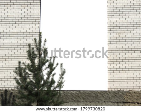 An empty white space for a banner ad on the wall of an ordinary brick house.
