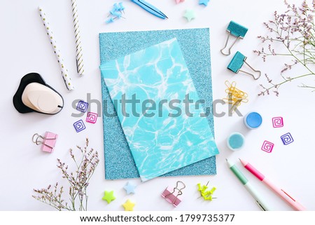 Flat lay of stationery on white background, copy space