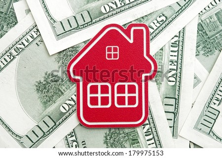 red home sign on hundred dollar bills. Real Estate business Concept  