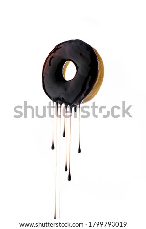 Pictures of fresh donuts With a syrup of chocolate trat, isolated white background.