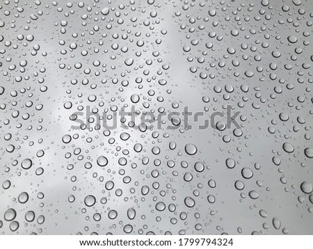 Full frame shot of wet glass window during rainy season, shot of raindrops on glass window