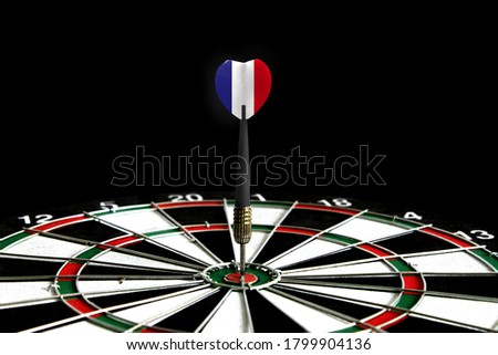 The flag of France is featured on the dart board game, the concept of achieving goals.