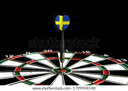 The flag of Sweden is featured on the dart board game, the concept of achieving goals.