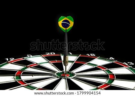 The flag of Brazil is featured on the dart board game, the concept of achieving goals.