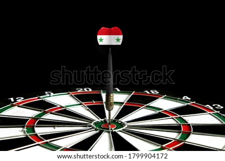 The flag of Syria is featured on the dart board game, the concept of achieving goals.
