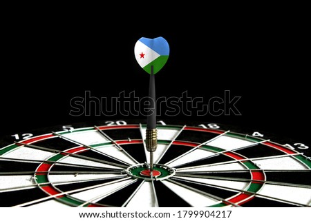 The flag of Djibouti is featured on the dart board game, the concept of achieving goals.