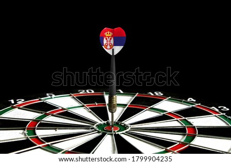 The flag of Serbia is featured on the dart board game, the concept of achieving goals.