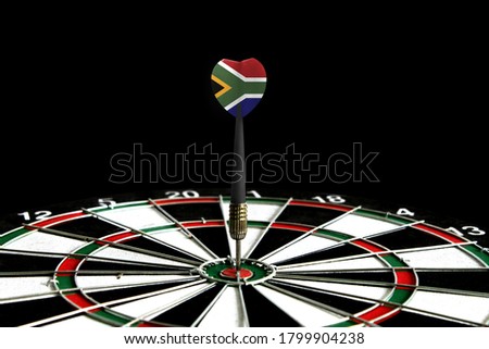 The flag of South Africa is featured on the dart board game, the concept of achieving goals.