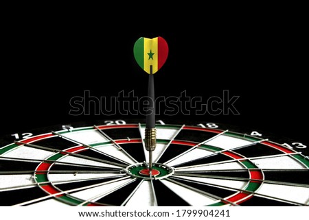 The flag of Senegal is featured on the dart board game, the concept of achieving goals.