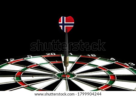 The flag of Norway is featured on the dart board game, the concept of achieving goals.
