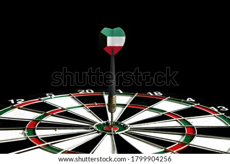 The flag of Kuwait is featured on the dart board game, the concept of achieving goals.