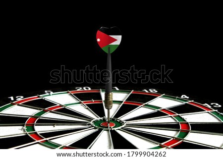 The flag of Jordan is featured on the dart board game, the concept of achieving goals.