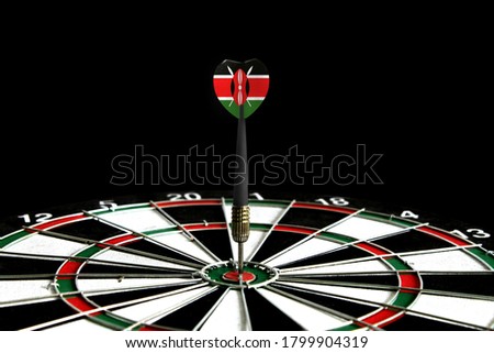 The flag of Kenya is featured on the dart board game, the concept of achieving goals.