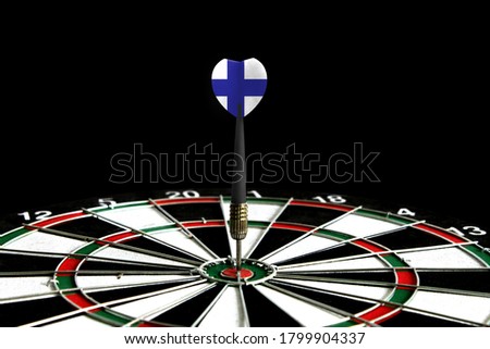 The flag of Finland is featured on the dart board game, the concept of achieving goals.