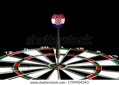 The flag of Croatia is featured on the dart board game, the concept of achieving goals.
