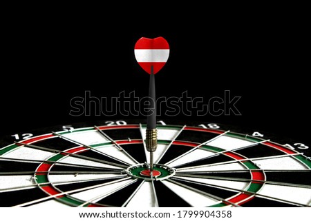 The flag of Austria is featured on the dart board game, the concept of achieving goals.