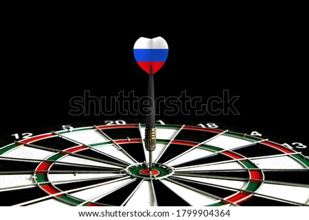 The flag of Russia is featured on the dart board game, the concept of achieving goals.