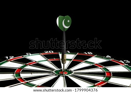 The flag of Pakistan is featured on the dart board game, the concept of achieving goals.
