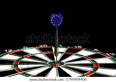The flag of European Union is featured on the dart board game, the concept of achieving goals.