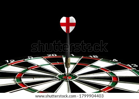 The flag of England is featured on the dart board game, the concept of achieving goals.