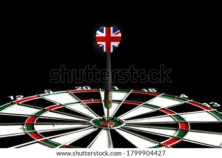 The flag of United Kingdom is featured on the dart board game, the concept of achieving goals.
