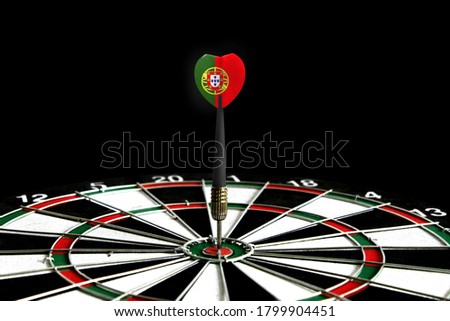 The flag of Portugal is featured on the dart board game, the concept of achieving goals.