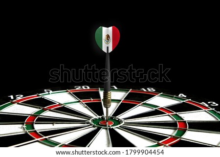 The flag of Mexico is featured on the dart board game, the concept of achieving goals.