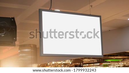 empty white screen with blank mock-up place for commercial advertising information hanging in store hall side view