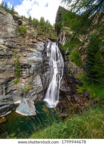 Lillaz waterfall in the Gran Paradiso National Park Royalty-Free Stock Photo #1799944678