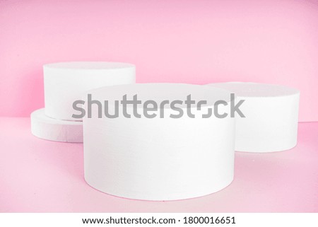 Creative background for various product display. Empty different white stand or podium mockup on pink background copy space