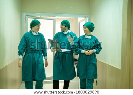 Portrait of team surgeon meeting in front the operating room.