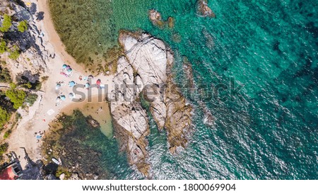 Aerial view of beautiful coastline in Mediterranean coast of Spain, Costa Brava. Panorama of Rocks on the coast in beautiful summer day. Beautiful beach with turquoise sea, boats, holiday destination