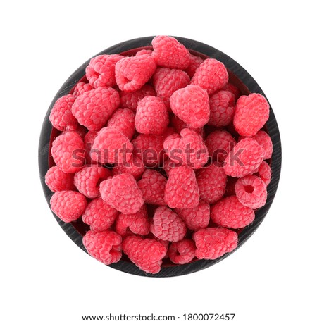 Delicious fresh ripe raspberries in bowl isolated on white, top view
