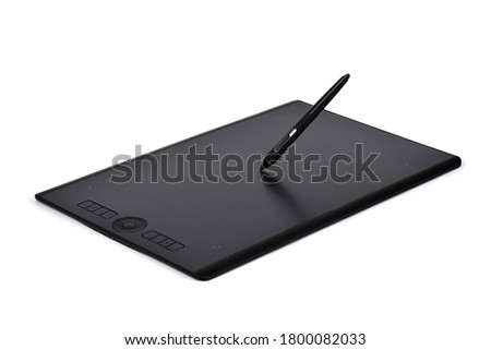 Professional graphics tablet with digitized pen. Isolated on white background. High resolution photo. Full depth of field.